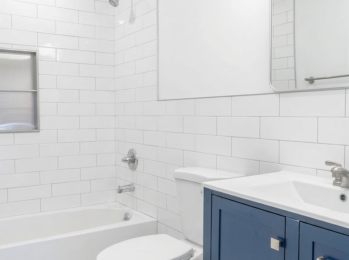 Full bathroom with tub and subway tile