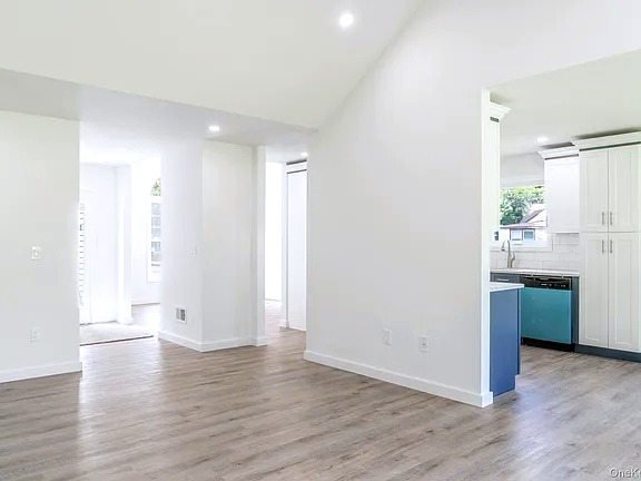 Open living area with vaulted ceilings