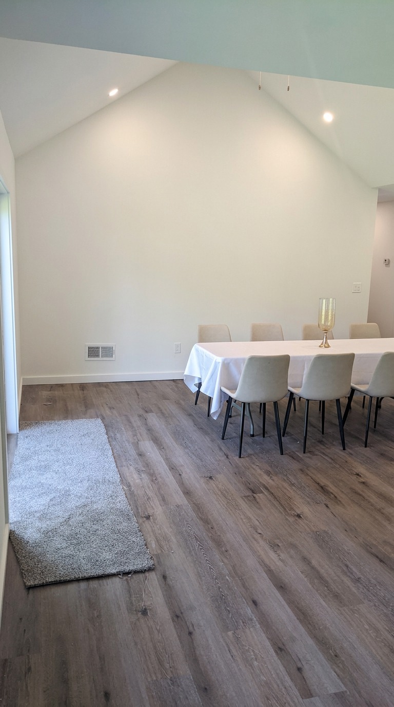 Dining room with large table and vaulted ceiling